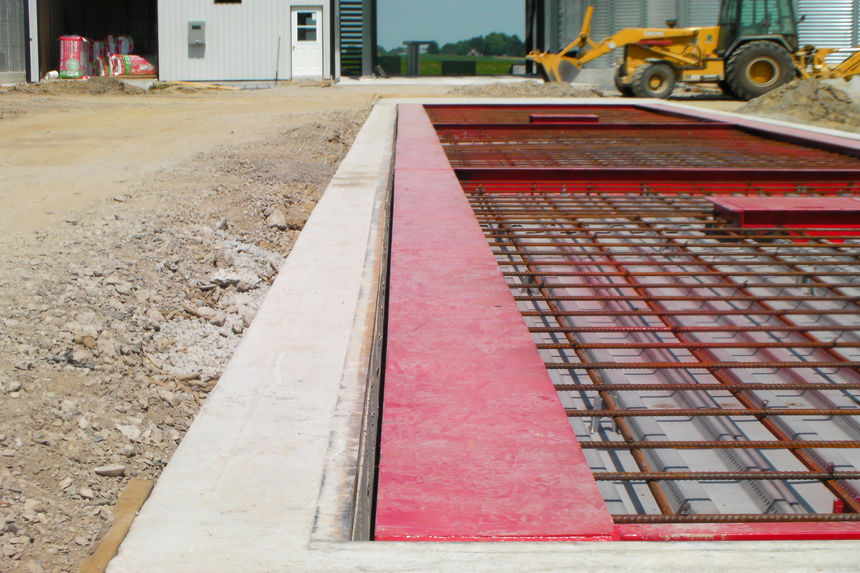 Concrete deck, above-ground scale installation in progress